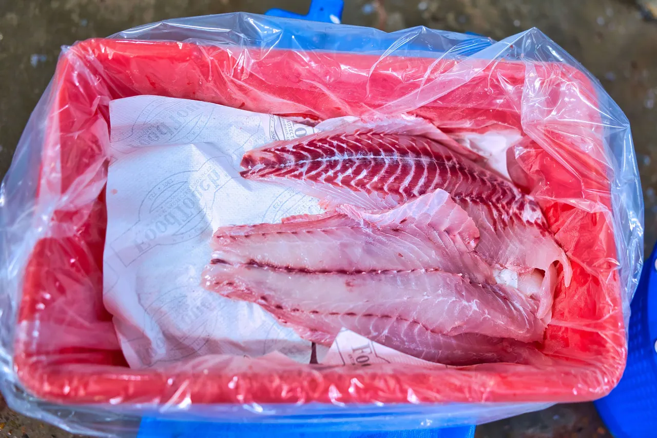 Fresh Fish fillets bagged and packed in a lined tote
